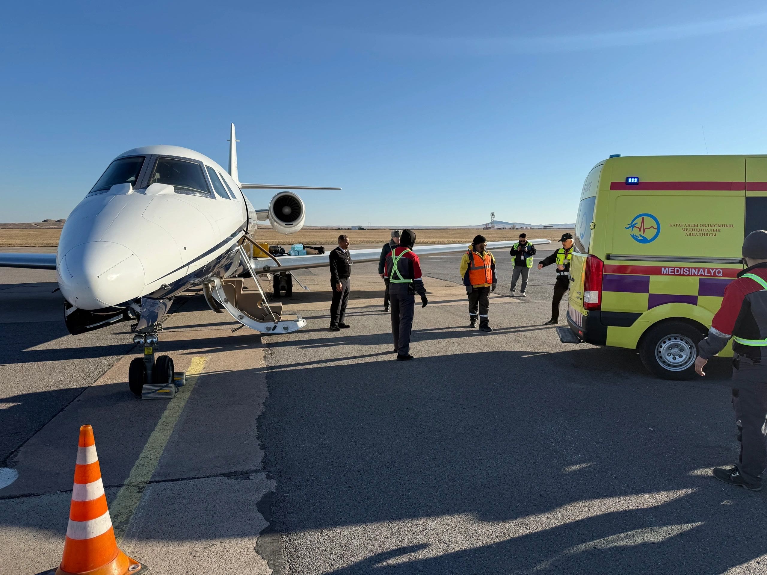 Air ambulance: medical team loading a patient onto the aircraft